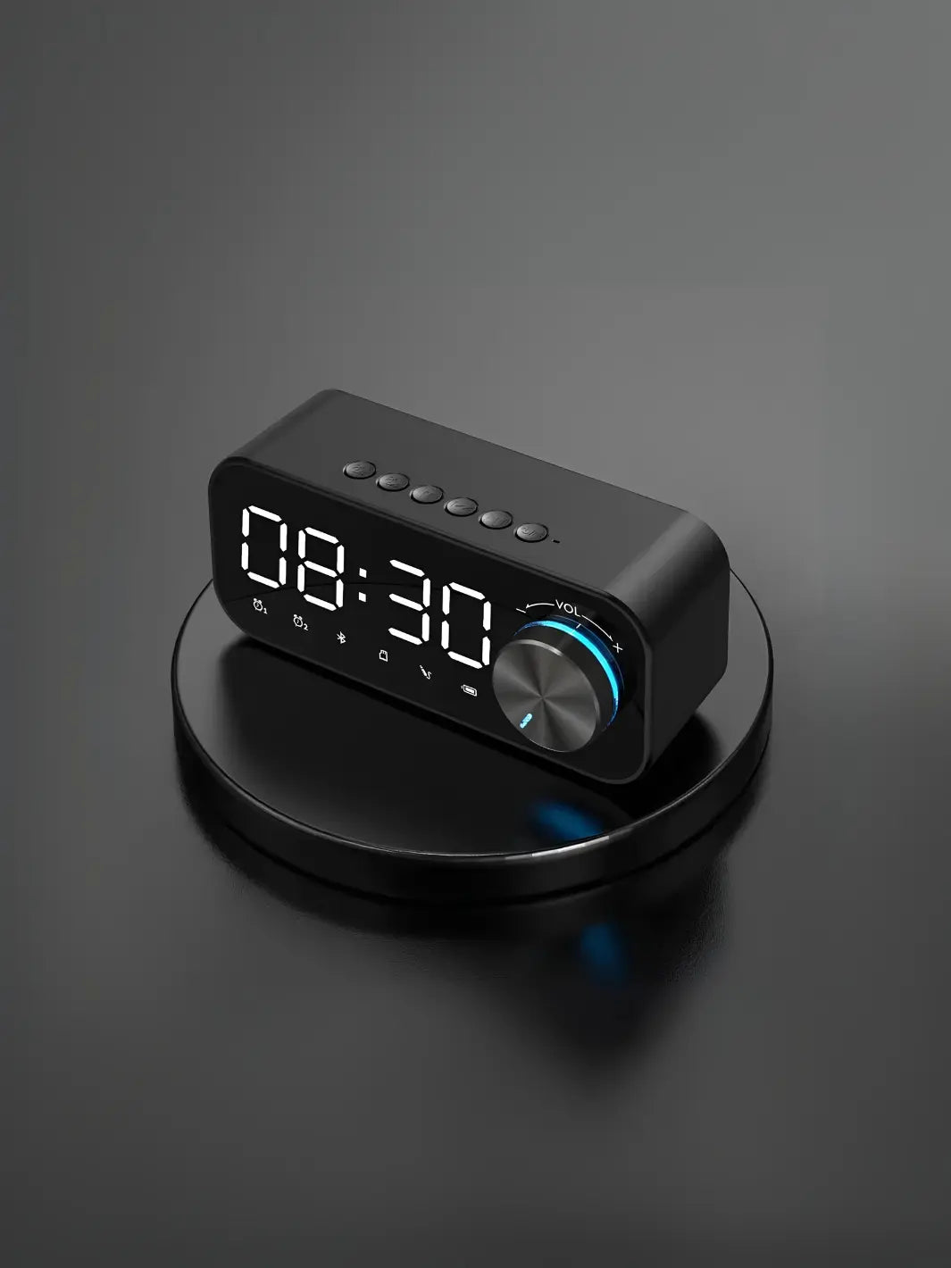 Radio réveil noir design posé sur un socle
